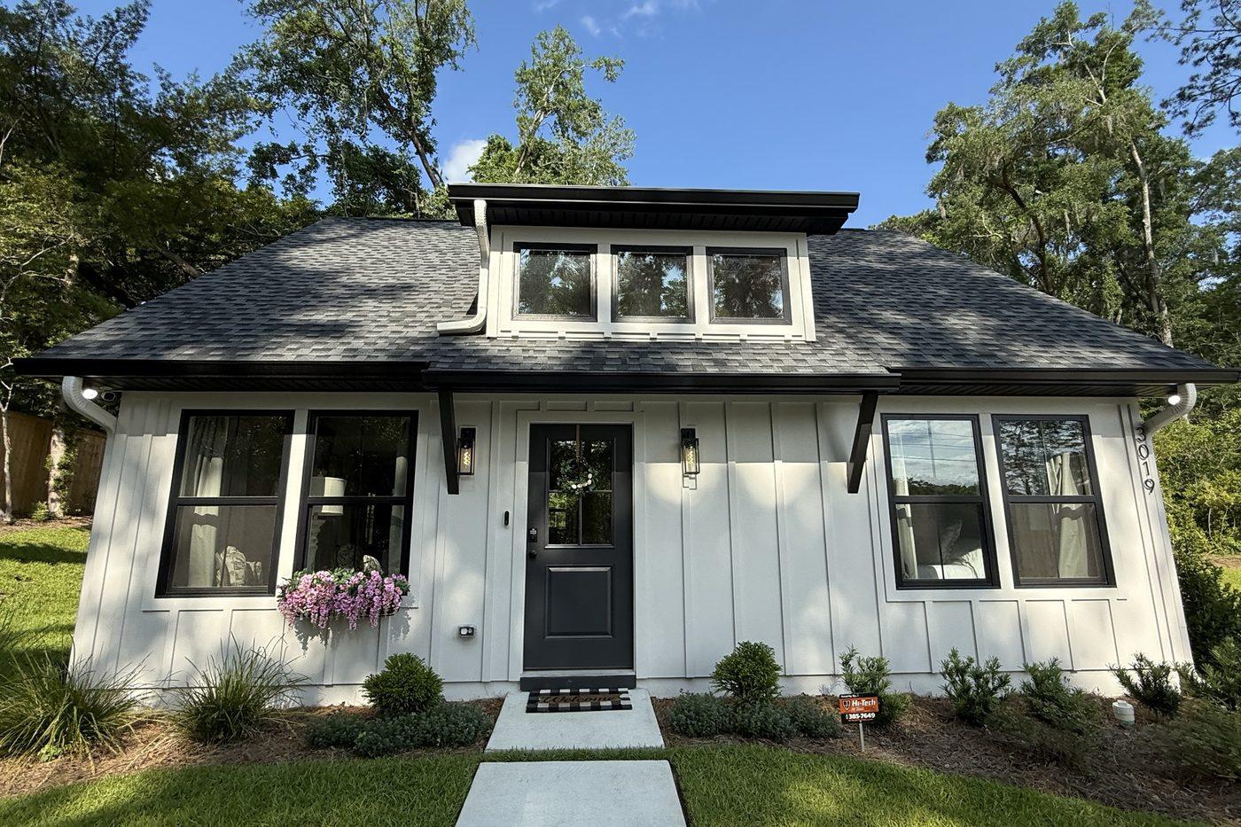 An 800 square foot accessory dwelling unit built by JSR Construction, with board and batten siding and black windows