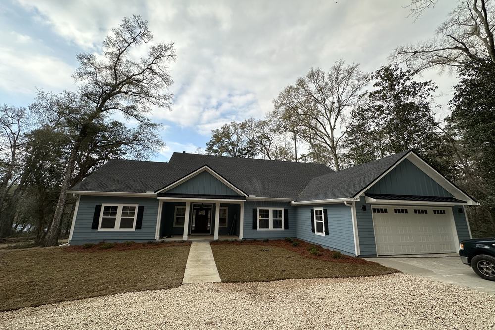 Long single-storey custom home with a side-entry garage
