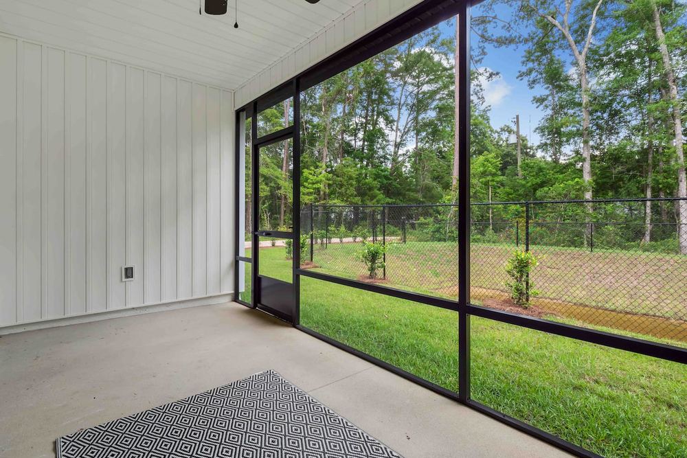 Screened porch looking out over the back lawn