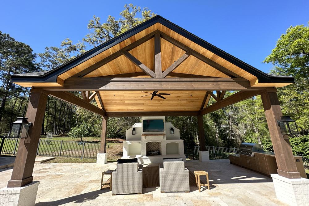 Inside a covered pavilion showing the stained cedar truss ceiling