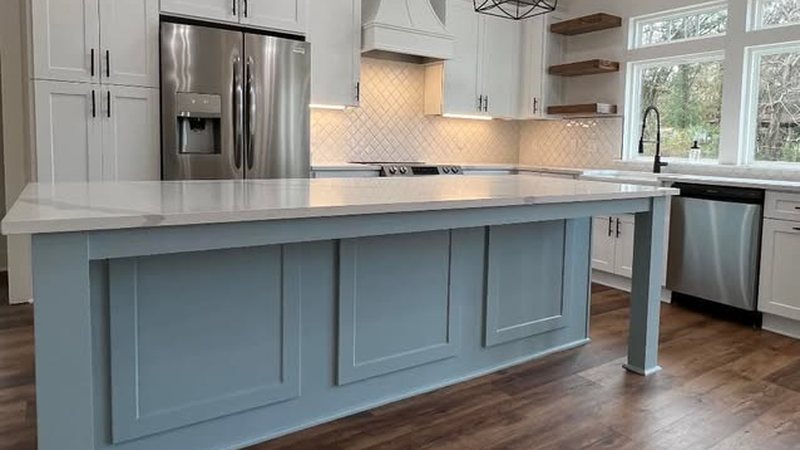 Custom kitchen cabinetry and island by JSR Construction